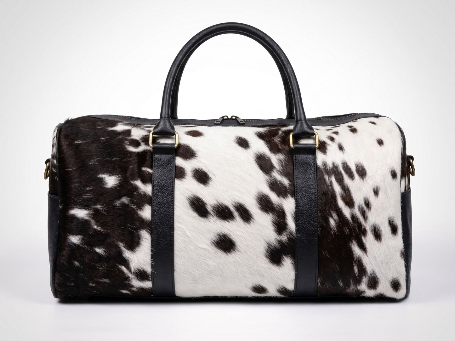 Hashmeers pure leather travel bag in black and white hair-on cowhide with black leather trim