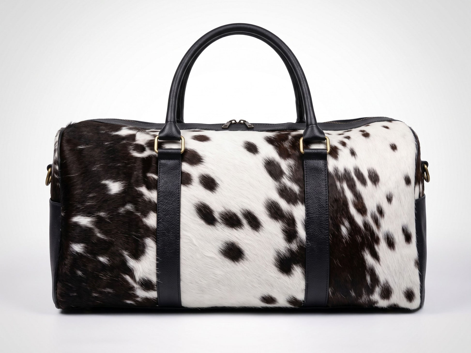 Hashmeers pure leather travel bag in black and white hair-on cowhide with black leather trim