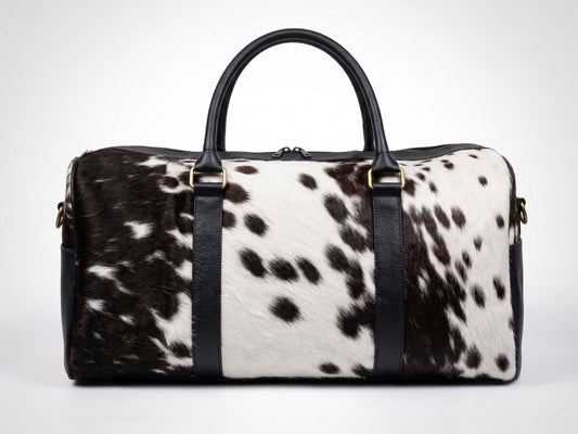 Hashmeers pure leather travel bag in black and white hair-on cowhide with black leather trim